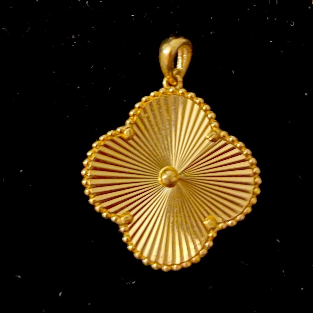 VanCleef yellow gold 18 karat pendant.  
5.22 grams of pure 18 k yellow gold.